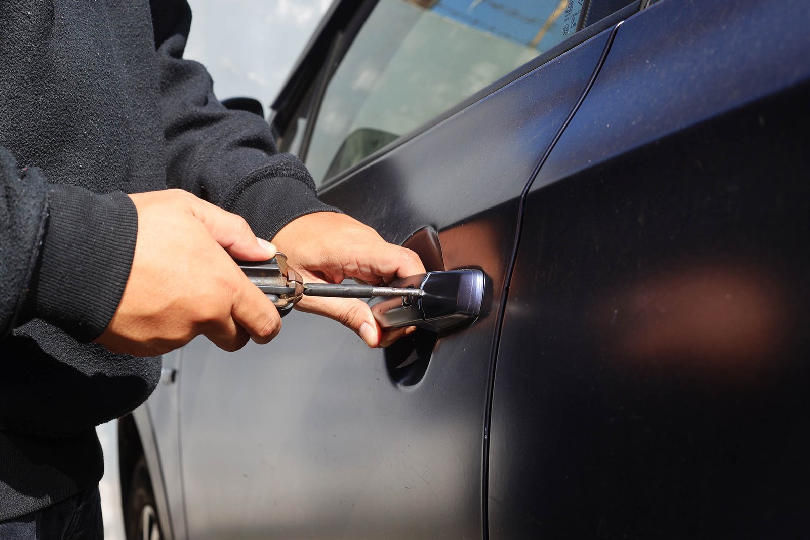 auto-thief-trying-to-break-into-car-with-screwdri-2025-03-16-23-37-10-utc Emergency vehicle lockout roadside assistance in Edmonton